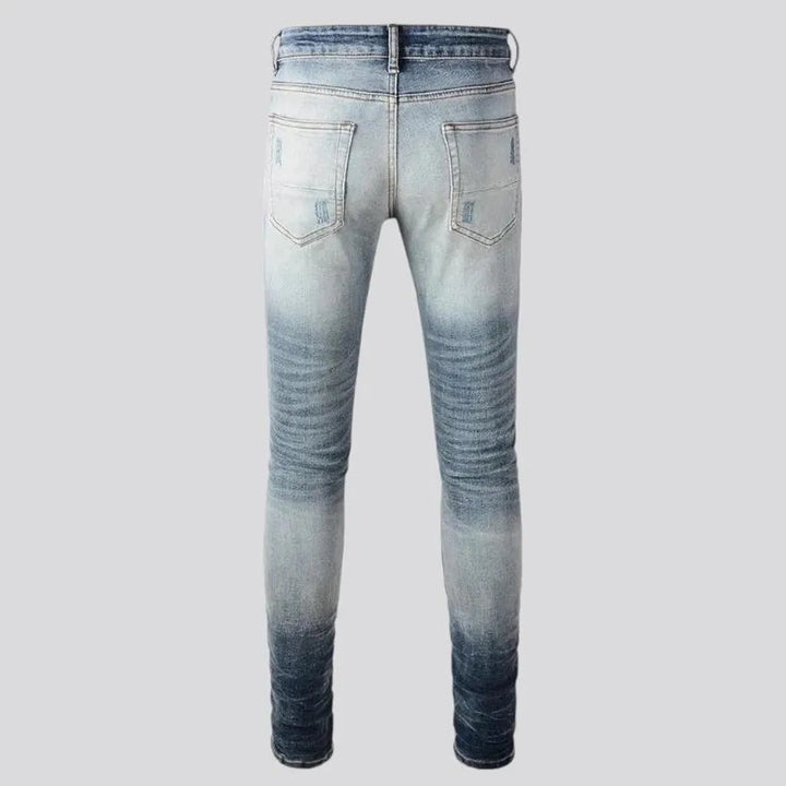 Whiskered mid rise skinny men's jeans