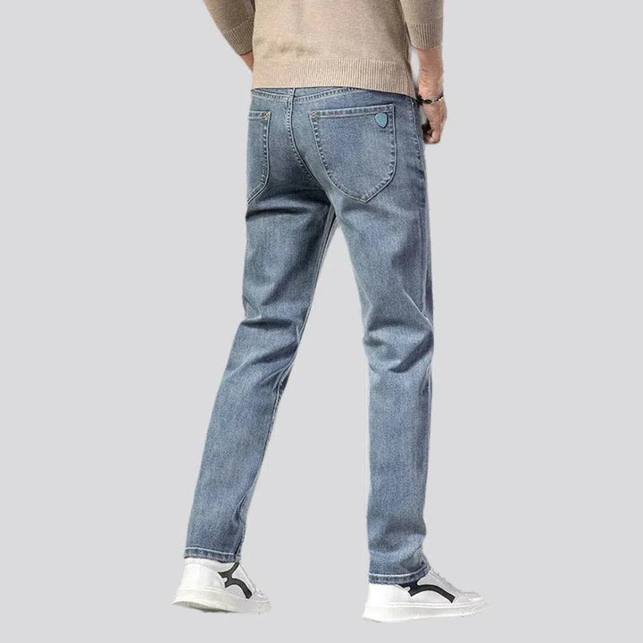 Stonewashed men's high-waist jeans