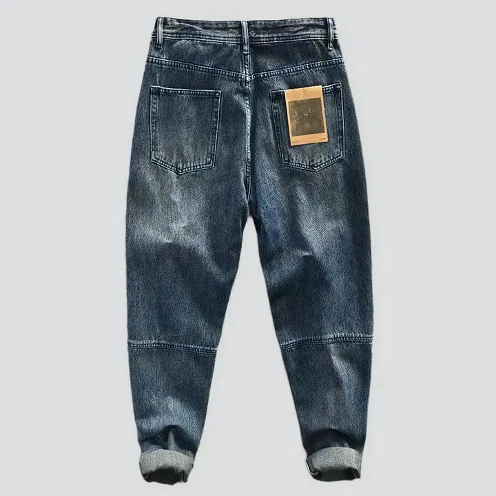Medium-wash men's mid-waist jeans