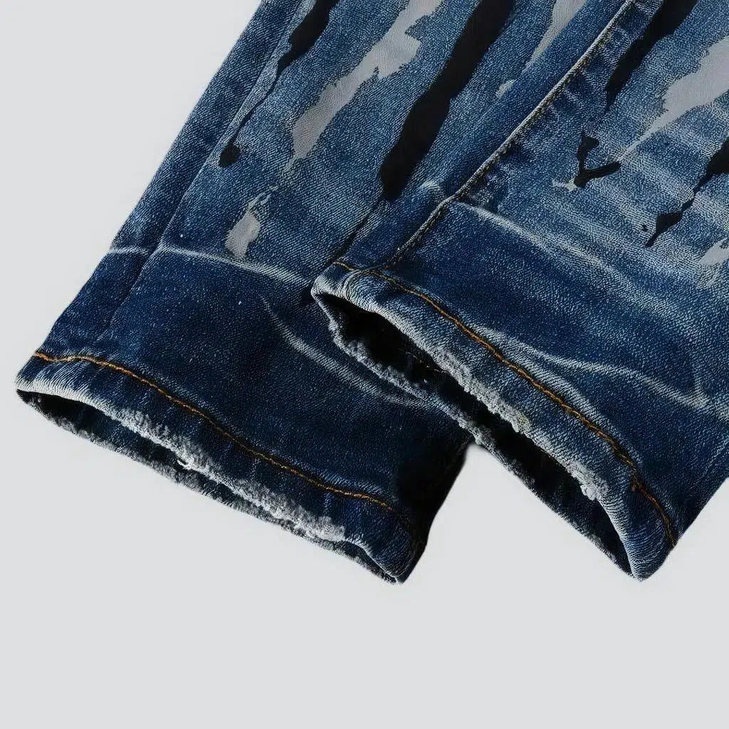 Painted men's light-wash jeans