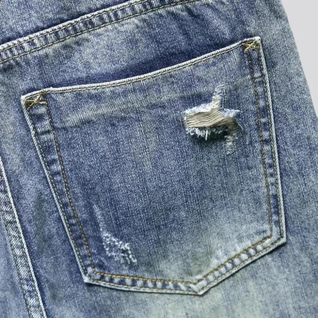 Medium-wash men's grunge jeans