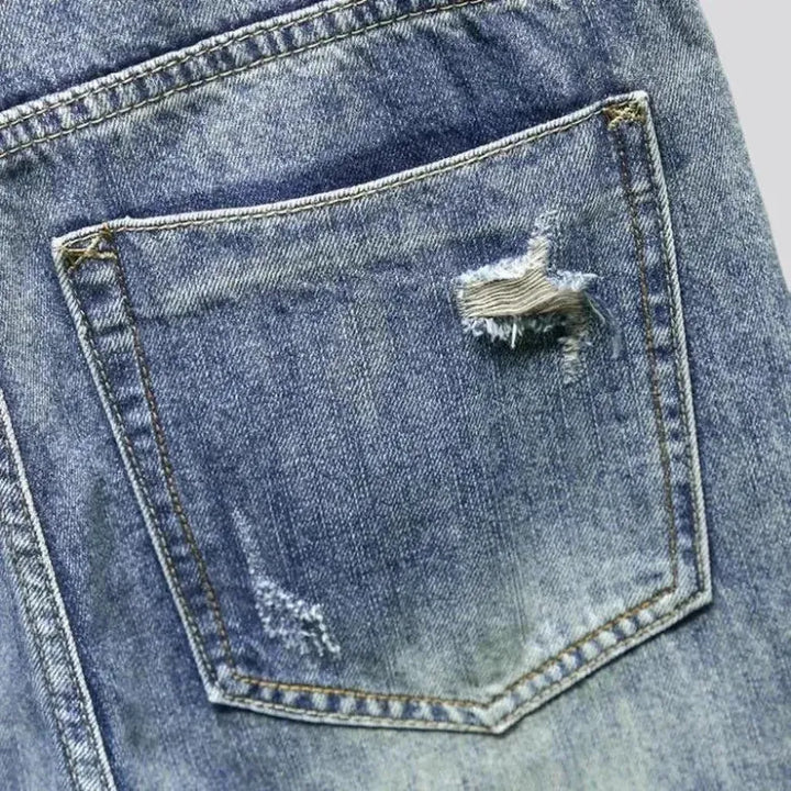 Medium-wash men's grunge jeans