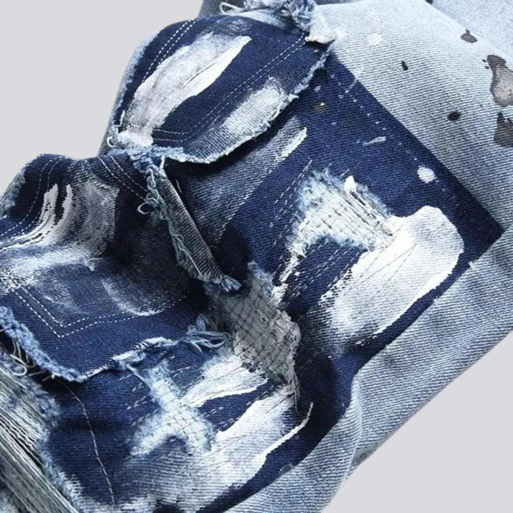 Paint-splattered men's patchwork jeans