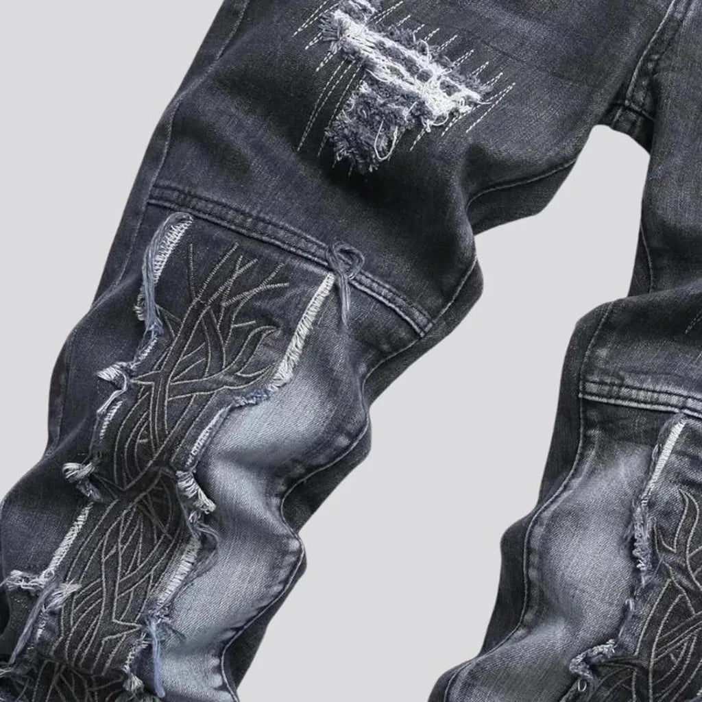 Whiskered embroidered distressed men's jeans