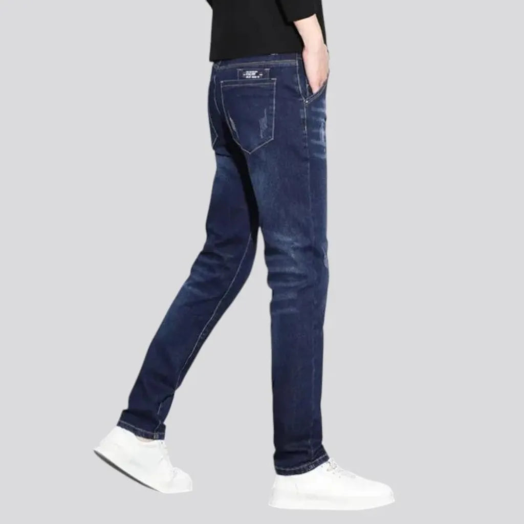 Dark abraded slim fit men's jeans