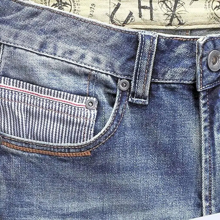 Whiskered striped small pocket jeans