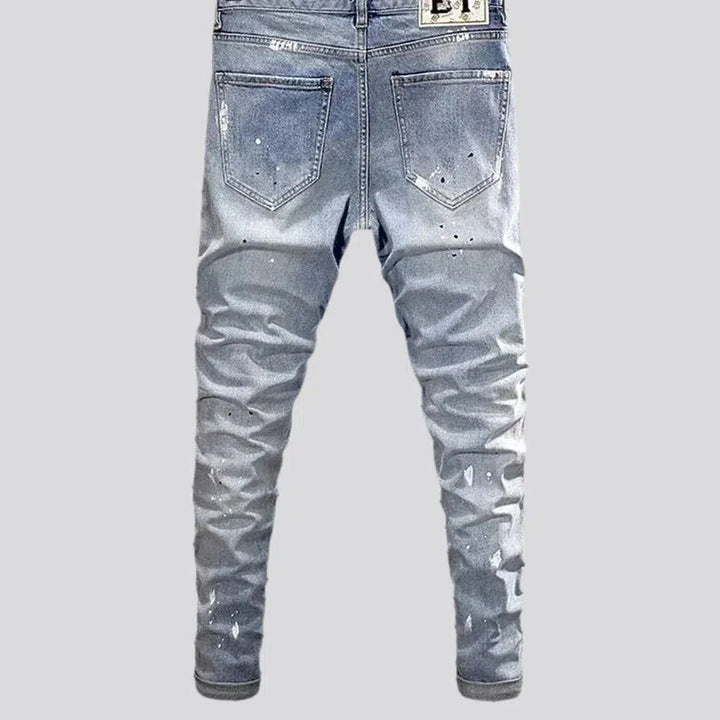 Ripped light men's wash jeans