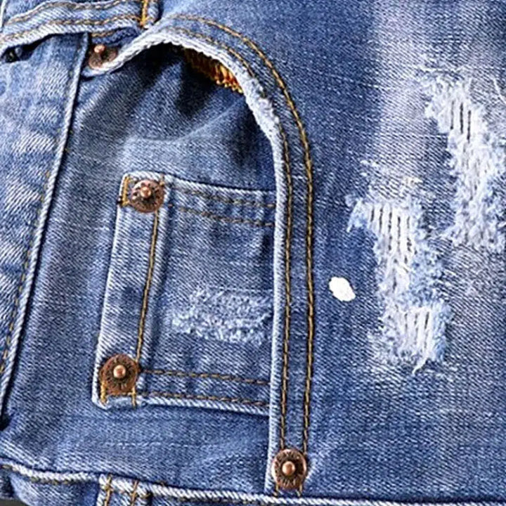 Grunge men's paint-splattered jeans