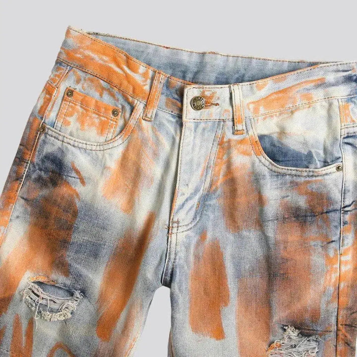 Light-wash men's painted jeans