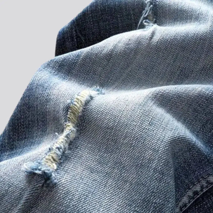 Medium wash men's whiskered jeans