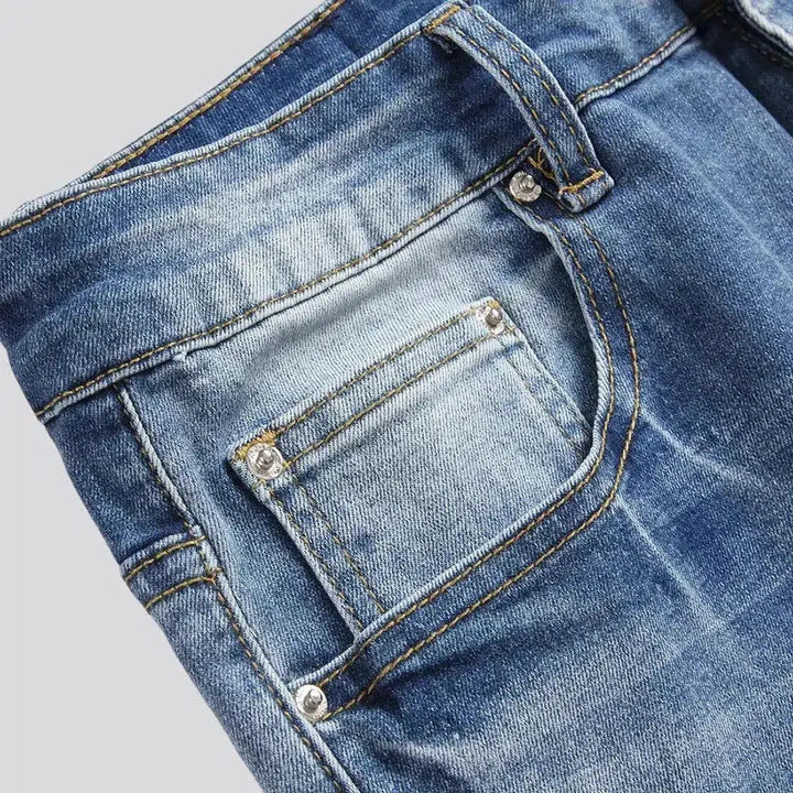 Skinny men's blue-patch jeans