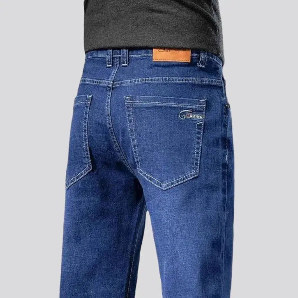 Stretchy men's mid-waist jeans