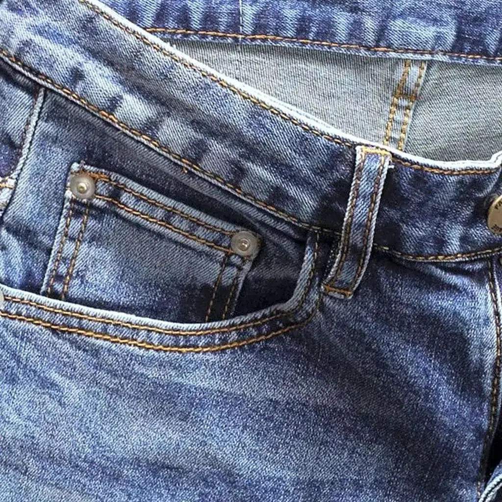 Sanded men's distressed jeans