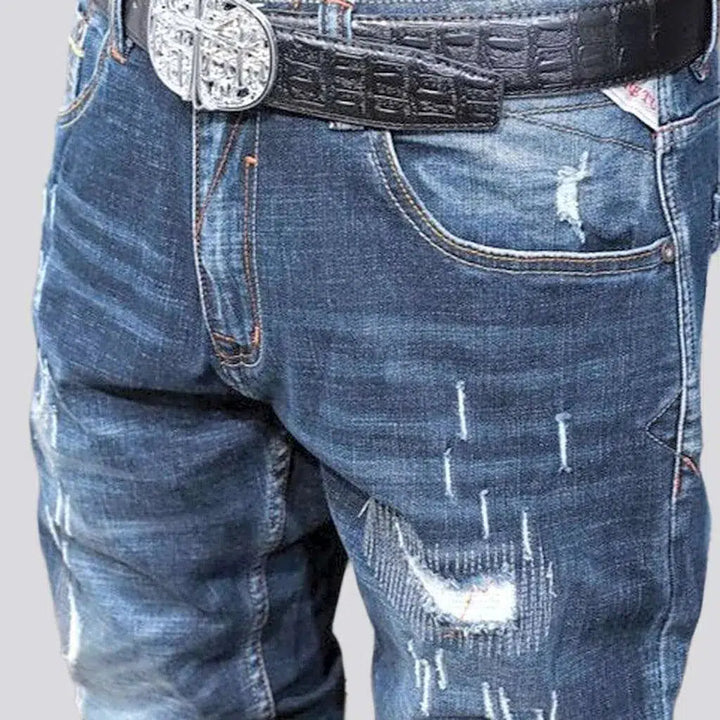 Grunge dark men's wash jeans