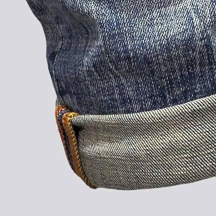 Distressed men's street jeans