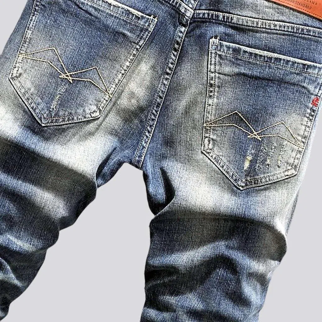 Distressed men's street jeans