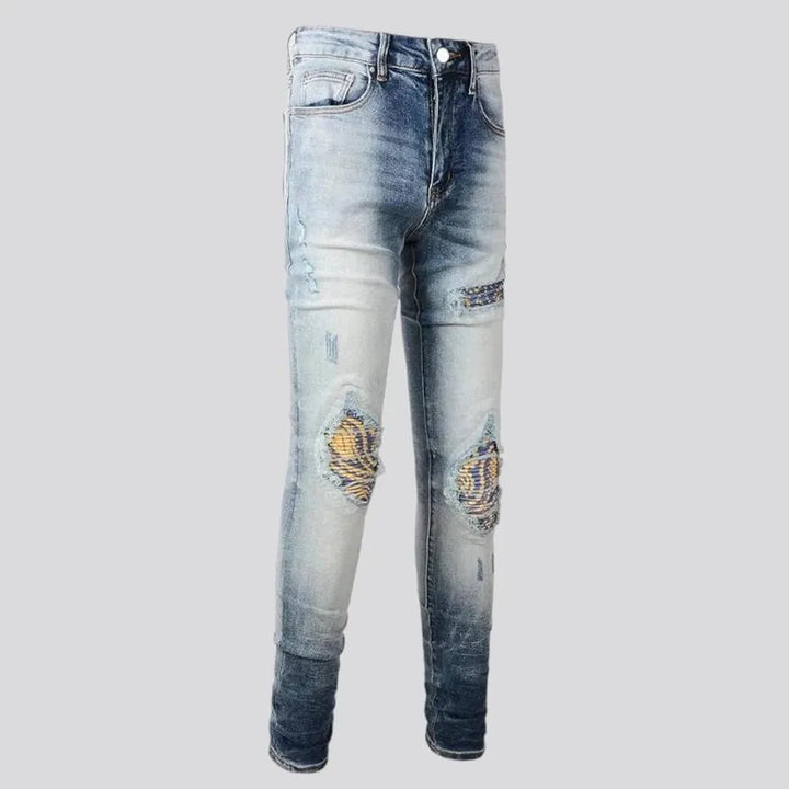 Whiskered mid rise skinny men's jeans