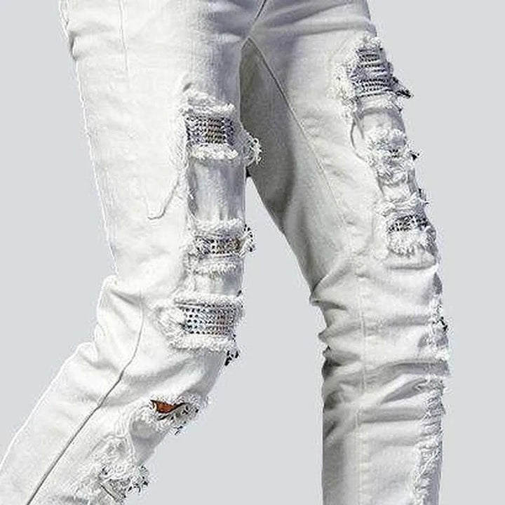 Embellished patchwork distressed jeans