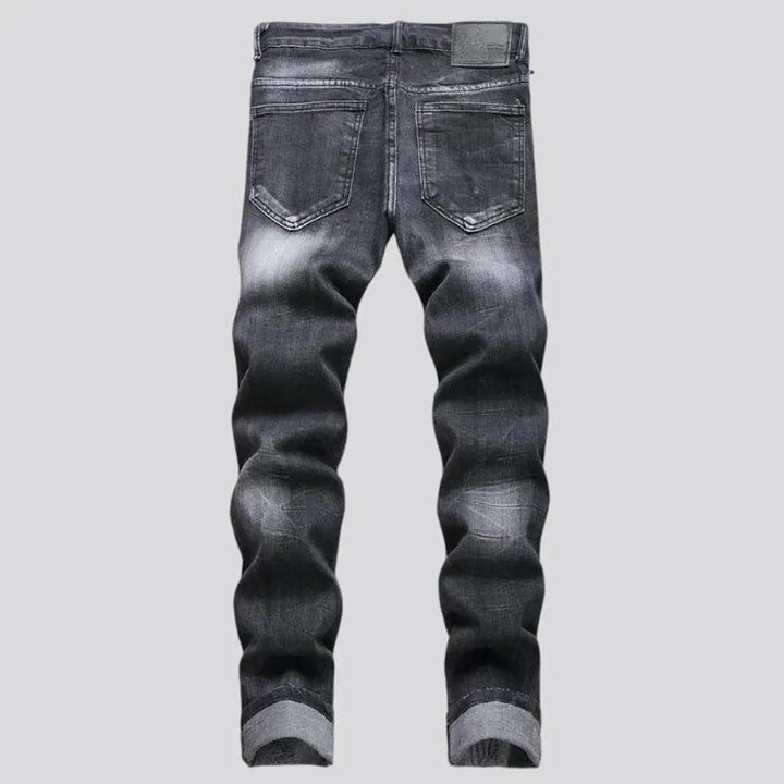 Whiskered embroidered distressed men's jeans