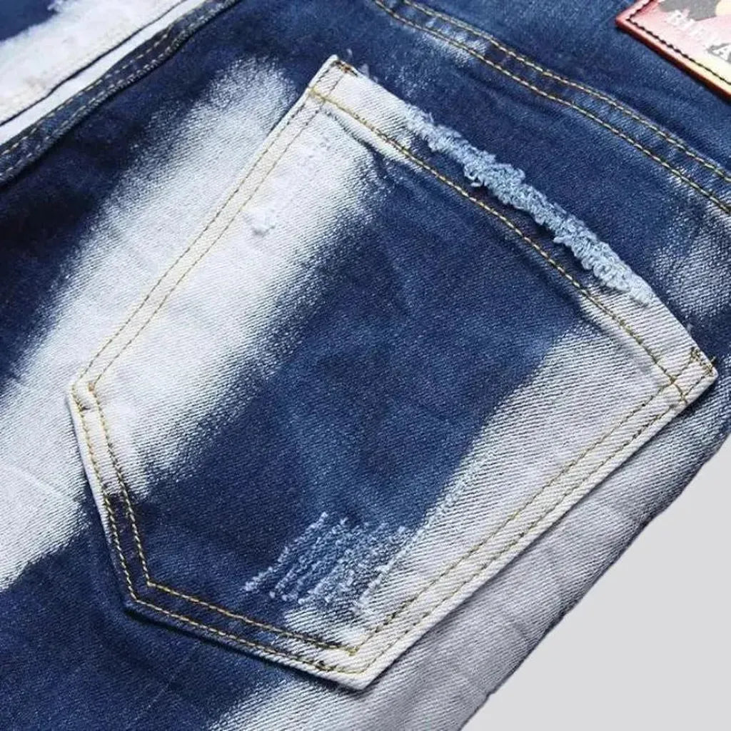 Mid-waist men's paint-splattered jeans