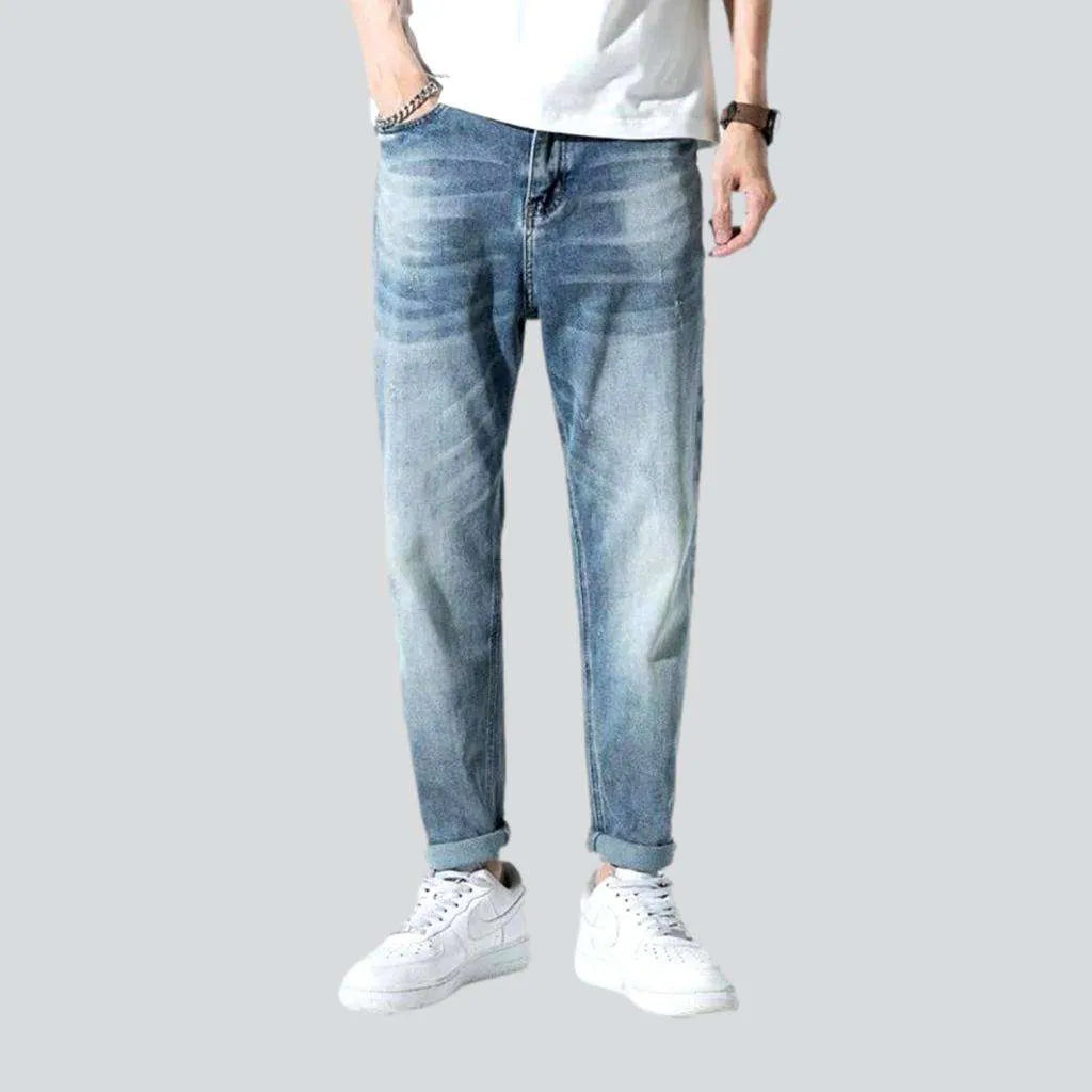 Mid-waist men's medium-wash jeans