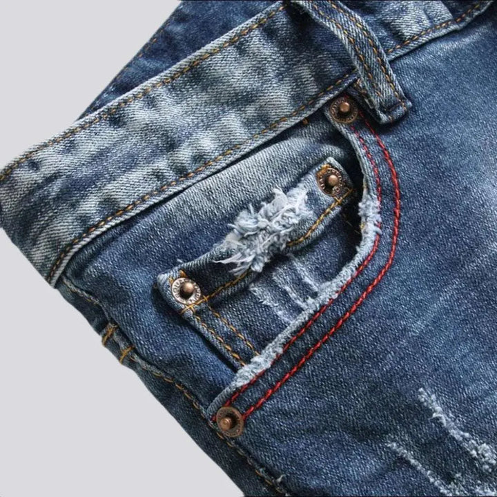 Mid-waist men's paint-splatter jeans