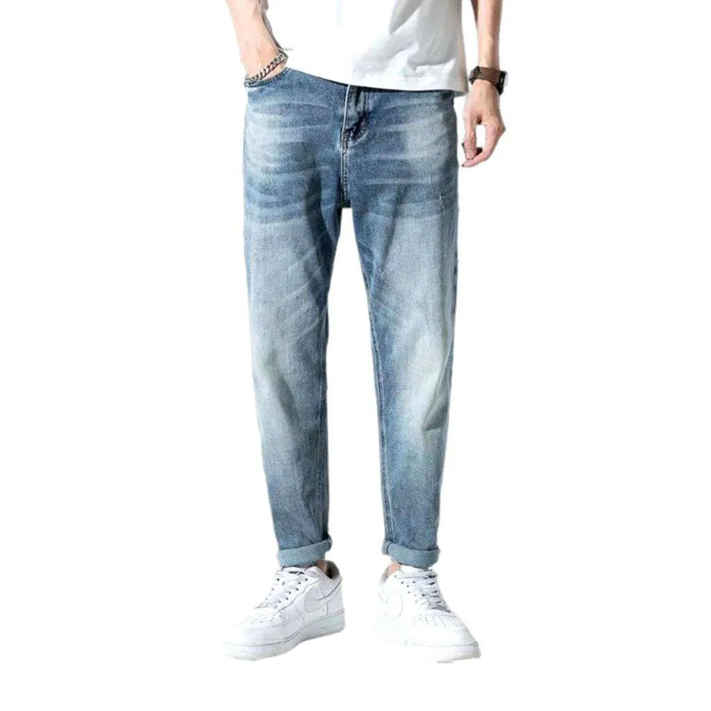 Mid-waist men's medium-wash jeans