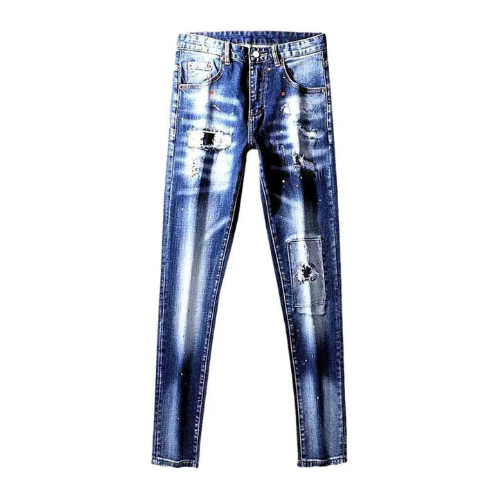 Paint-splattered distressed jeans