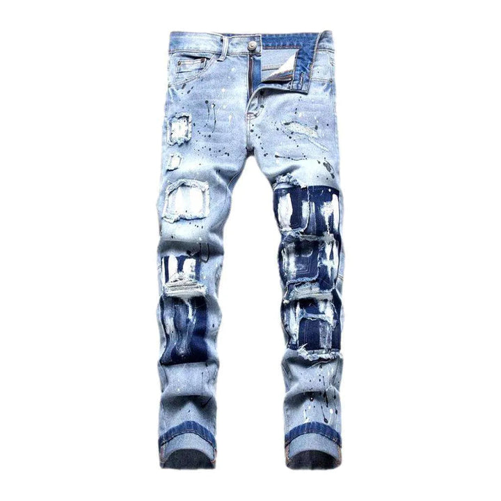 Paint-splattered men's patchwork jeans