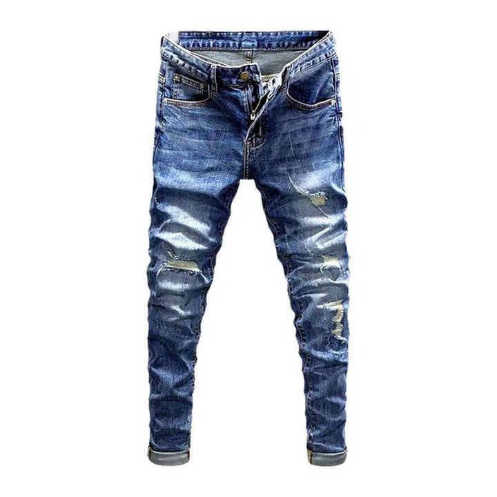 Sanded men's distressed jeans